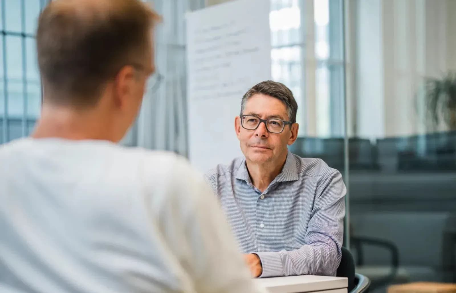 Hubert Lechner talking with a manager